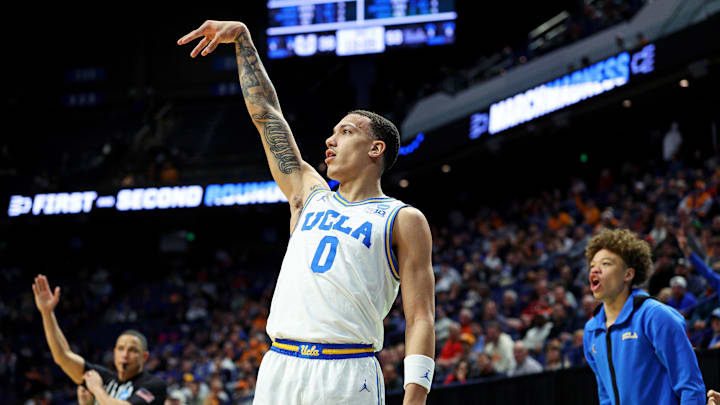 Mar 20, 2025; Lexington, KY, USA; UCLA Bruins guard Kobe Johnson (0) shoots the ball during the second half against the Utah State Aggies in the first round of the NCAA Tournament at Rupp Arena. Mandatory Credit: Jordan Prather-Imagn Images Mar 20, 2025; Lexington, KY, USA; UCLA Bruins guard Kobe Johnson (0) shoots the ball during the second half against the Utah State Aggies in the first round of the NCAA Tournament at Rupp Arena. Mandatory Credit: Jordan Prather-Imagn Images