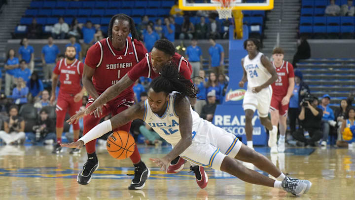 Nov 26, 2024; Los Angeles, California, USA; UCLA Bruins guard Sebastian Mack (12) and Southern Utah Thunderbirds guard Tavi Jackson (2) and guard Dominique Ford (1) chase a loose ball in the first half at Pauley Pavilion presented by Wescom. Mandatory Credit: Kirby Lee-Imagn Images
