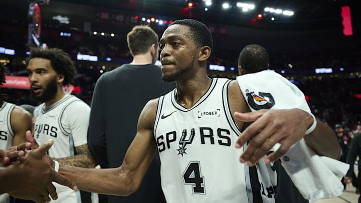 Apr 26, 2026; Portland, Oregon, USA; San Antonio Spurs guard De'aaron Fox (4) celebrates with teammates after a game against the Portland Trail Blazers during game four of the first round of the 2026 NBA Playoffs at Moda Center. Mandatory Credit: Troy Wayrynen-Imagn Images