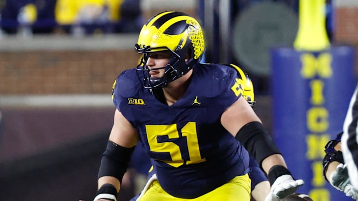 Nov 23, 2024; Ann Arbor, Michigan, USA;  Michigan Wolverines offensive lineman Greg Crippen (51) blocks against the Northwestern Wildcats at Michigan Stadium. Mandatory Credit: Rick Osentoski-Imagn Images
