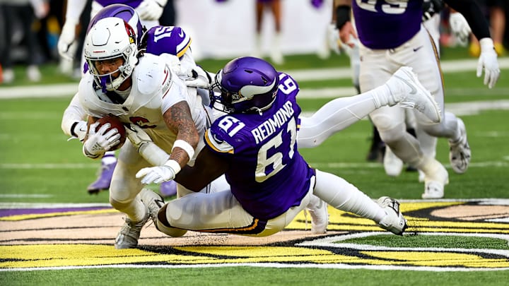 Vikings DT Jalen Redmond tackles Cardinals RB James Conner for a loss of yardage. Vikings DT Jalen Redmond tackles Cardinals RB James Conner for a loss of yardage.