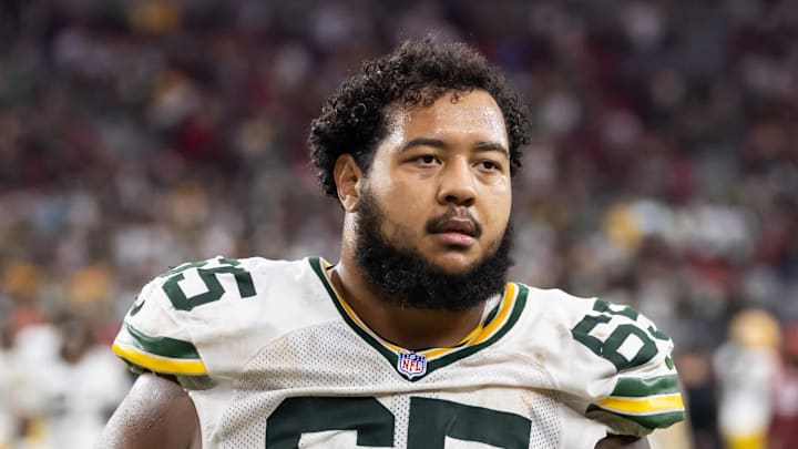Oct 19, 2025; Glendale, Arizona, USA; Green Bay Packers guard Aaron Banks (65) against the Arizona Cardinals at State Farm Stadium. Mandatory Credit: Mark J. Rebilas-Imagn Images