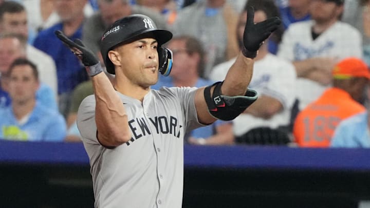 Oct 10, 2024; Kansas City, Missouri, USA; New York Yankees designated hitter Giancarlo Stanton (27) celebrates an RBI single during the sixth inning against the Kansas City Royals during game four of the ALDS for the 2024 MLB Playoffs at Kauffman Stadium. Mandatory Credit: Denny Medley-Imagn Images Oct 10, 2024; Kansas City, Missouri, USA; New York Yankees designated hitter Giancarlo Stanton (27) celebrates an RBI single during the sixth inning against the Kansas City Royals during game four of the ALDS for the 2024 MLB Playoffs at Kauffman Stadium. Mandatory Credit: Denny Medley-Imagn Images