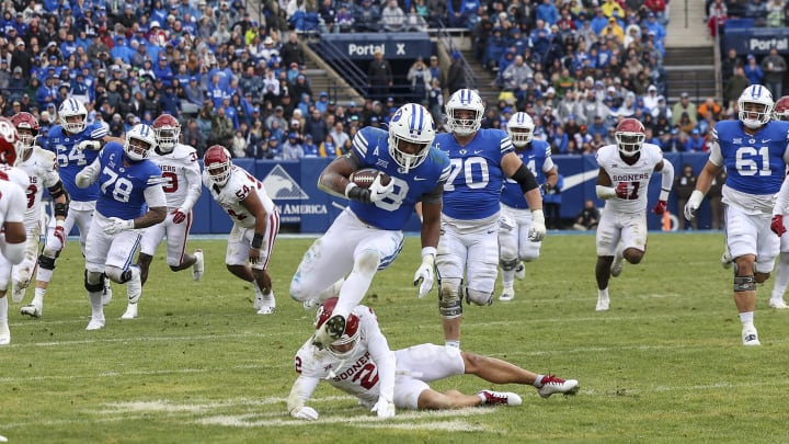 Nov 18, 2023; Provo, Utah, USA; Brigham Young Cougars running back Aidan Robbins (3) breaks a tackle
