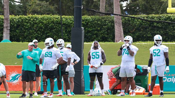Miami Dolphins offensive line coach Zach Yenser speaks to guard Jamaree Salyer during practice at the Baptist Health Training Complex. Miami Dolphins offensive line coach Zach Yenser speaks to guard Jamaree Salyer during practice at the Baptist Health Training Complex.