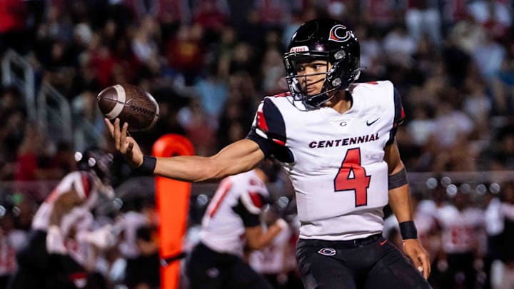 Centennial Huskies Quarterback Husan Longstreet (4) catches the ball at Liberty High School on Sept. 21, 2024, in Peoria.
