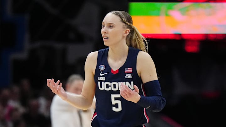 Apr 5, 2024; Cleveland, OH, USA; Connecticut Huskies guard Paige Bueckers (5) reacts in the second quarter against the Iowa Hawkeyes in the semifinals of the Final Four of the womens 2024 NCAA Tournament at Rocket Mortgage FieldHouse. Mandatory Credit: Kirby Lee-Imagn Images Apr 5, 2024; Cleveland, OH, USA; Connecticut Huskies guard Paige Bueckers (5) reacts in the second quarter against the Iowa Hawkeyes in the semifinals of the Final Four of the womens 2024 NCAA Tournament at Rocket Mortgage FieldHouse. Mandatory Credit: Kirby Lee-Imagn Images