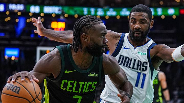 Feb 6, 2025; Boston, Massachusetts, USA; Dallas Mavericks guard Kyrie Irving (11) defends against Boston Celtics guard Jaylen Brown (7) in the second half at TD Garden. Mandatory Credit: David Butler II-Imagn Images