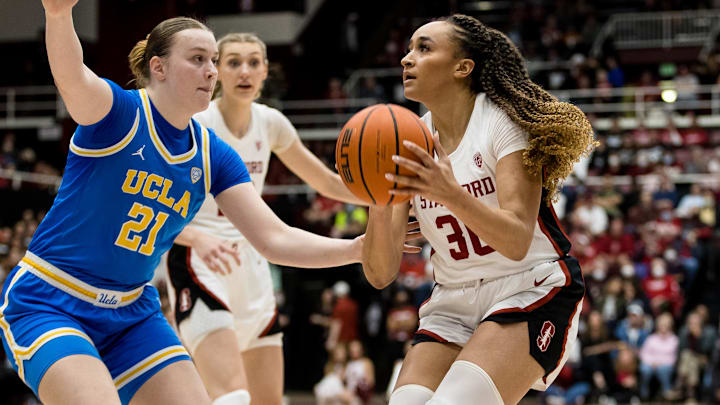 Feb 20, 2023; Stanford, California, USA;  UCLA Bruins forward Lina Sontag (21) defends Stanford Cardinal guard Haley Jones (30) during the first half at Maples Pavilion. Mandatory Credit: John Hefti-Imagn Images