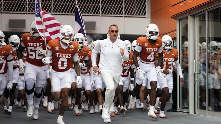 Sep 6, 2025; Austin, Texas, USA; Texas Longhorns head coach Steve Sarkisian leads players on to the field before the game against the San Jose State Spartans at Darrell K Royal-Texas Memorial Stadium. Mandatory Credit: Scott Wachter-Imagn Images