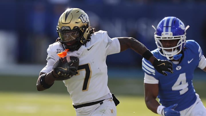 Nov 29, 2025; Provo, Utah, USA; UCF Knights wide receiver Duane Thomas Jr. (7) runs after a catch against BYU Cougars cornerback Mory Bamba (4) during the first quarter at LaVell Edwards Stadium. Mandatory Credit: Rob Gray-Imagn Images Nov 29, 2025; Provo, Utah, USA; UCF Knights wide receiver Duane Thomas Jr. (7) runs after a catch against BYU Cougars cornerback Mory Bamba (4) during the first quarter at LaVell Edwards Stadium. Mandatory Credit: Rob Gray-Imagn Images