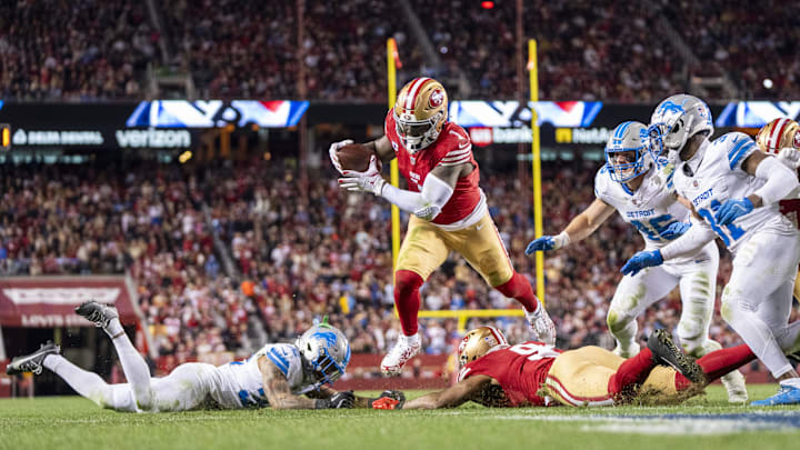 December 30, 2024; Santa Clara, California, USA; San Francisco 49ers wide receiver Deebo Samuel Sr. (1) scores a touchdown against the Detroit Lions during the third quarter at Levi's Stadium.