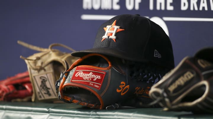 Aug 20, 2022; Atlanta, Georgia, USA; A detailed view of the hat and glove of Houston Astros right fielder Kyle Tucker (not pictured) against the Atlanta Braves in the eleventh inning at Truist Park. Aug 20, 2022; Atlanta, Georgia, USA; A detailed view of the hat and glove of Houston Astros right fielder Kyle Tucker (not pictured) against the Atlanta Braves in the eleventh inning at Truist Park.