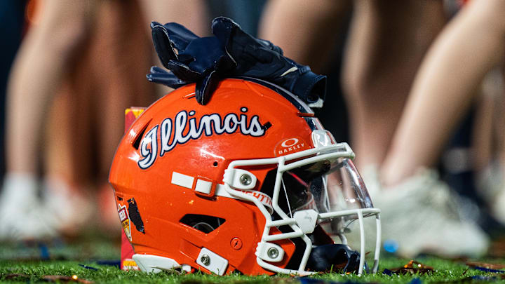 Dec 31, 2024; Orlando, FL, USA; A Illinois Fighting Illini helmet sitting on confetti after the game against the South Carolina Gamecocks at Camping World Stadium. Mandatory Credit: Jeremy Reper-Imagn Images