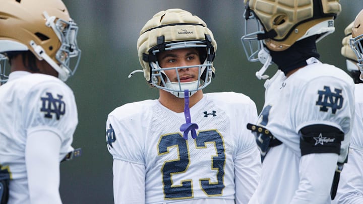 Notre Dame safety Kennedy Urlacher (23) talks with teammates on the sidelines during a Notre Dame football practice at Irish Athletic Center on Monday, Dec. 16, 2024, in South Bend.