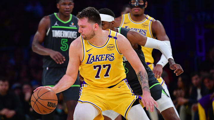 Apr 30, 2025; Los Angeles, California, USA; Los Angeles Lakers guard Luka Doncic (77) controls the ball against the Minnesota Timberwolves during the second half in game five of first round for the 2025 NBA Playoffs at Crypto.com Arena. Mandatory Credit: Gary A. Vasquez-Imagn Images