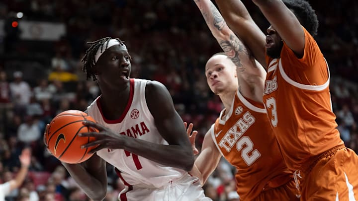 Jan 10, 2026; Tuscaloosa, AL, USA; Alabama forward Taylor Bol Bowen (7) is cut off by Texas guard Chendall Weaver (2) qnd Texas forward Lassina Traore (23) at Coleman Coliseum. Mandatory Credit: Gary Cosby Jr.-Tuscaloosa News