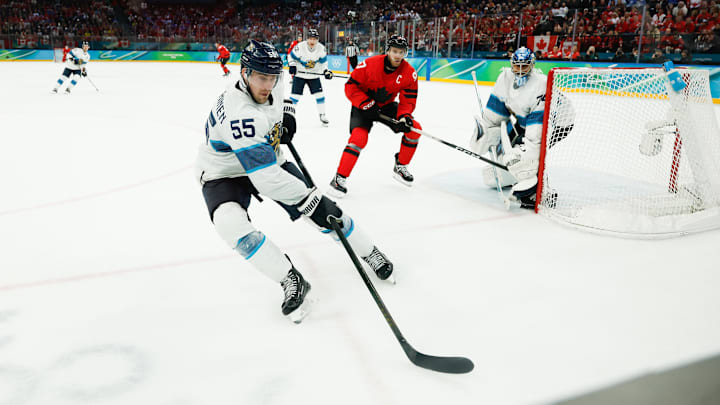 Feb 20, 2026; Milan, Italy; Rasmus Ristolainen (55) of Finland chases the puck during the third period against Canada in a men's ice hockey semifinal during the Milano Cortina 2026 Olympic Winter Games at Milano Santagiulia Ice Hockey Arena. Mandatory Credit: Geoff Burke-Imagn Images