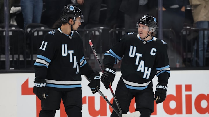 Utah Hockey Club right wing Dylan Gunther and center Clayton Keller reacts to a goal against the Minnesota Wild.