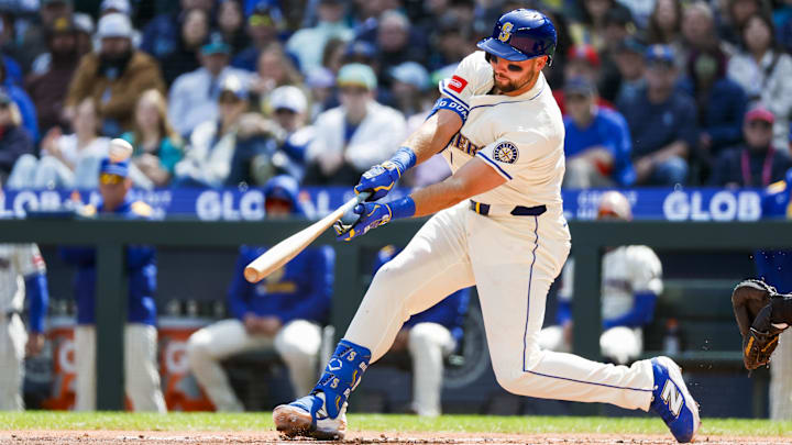 Seattle Mariners catcher Cal Raleigh hits a home run during a game against the Texas Rangers on April 13 at T-Mobile Park.