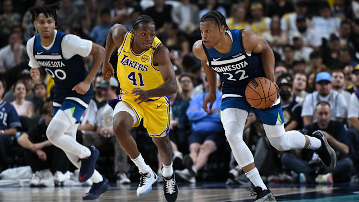 Oct 4, 2024; Palm Desert, California, USA; Minnesota Timberwolves guard Jaylen Clark (22) moves the ball against Los Angeles Lakers guard Quincy Olivari (41) during the second half at Acrisure Arena. Mandatory Credit: Jonathan Hui-Imagn Images