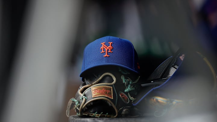 Aug 8, 2024; Denver, Colorado, USA; A New York Mets hat and glove in the dugout in the second inning against the Colorado Rockies at Coors Field. Mandatory Credit: Isaiah J. Downing-Imagn Images