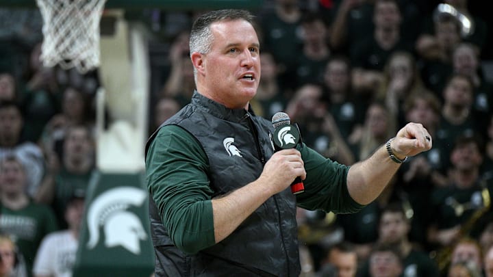 Dec 2, 2025; East Lansing, Michigan, USA;  Michigan State head football coach Pat Fitzgerald watches the Spartans defeat the Iowa Hawkeyes at Jack Breslin Student Events Center. Mandatory Credit: Dale Young-Imagn Images