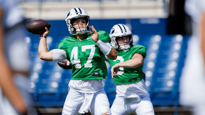 BYU quarterbacks Bear Bachmeier and McCae Hillstead warm up for the first scrimmage of Fall Camp