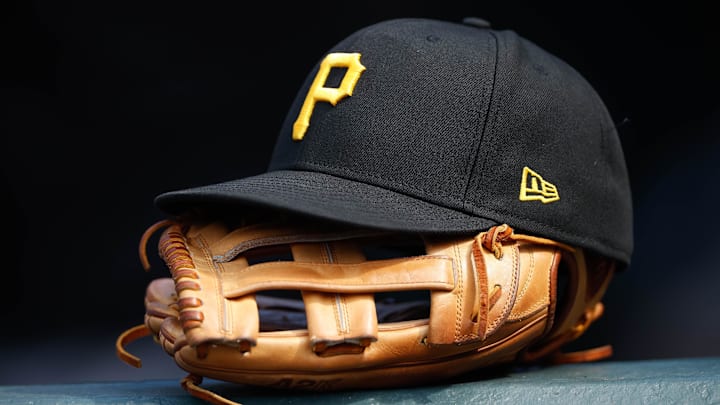 Jun 30, 2021; Denver, Colorado, USA; A general view of a Pittsburgh Pirates glove and hat in the eighth inning against the Colorado Rockies at Coors Field. Mandatory Credit: Isaiah J. Downing-Imagn Images