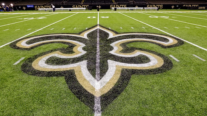 Oct 30, 2022; New Orleans, Louisiana, USA; General view of the New Orleans Saints logo as the midfield logo fleur-de-lis after the game between the New Orleans Saints and the Las Vegas Raiders at Caesars Superdome. Mandatory Credit: Stephen Lew-Imagn Images Oct 30, 2022; New Orleans, Louisiana, USA; General view of the New Orleans Saints logo as the midfield logo fleur-de-lis after the game between the New Orleans Saints and the Las Vegas Raiders at Caesars Superdome. Mandatory Credit: Stephen Lew-Imagn Images