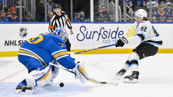 Oct 23, 2025; St. Louis, Missouri, USA; Utah Mammoth center Logan Cooley (92) shoots and scores against St. Louis Blues goaltender Joel Hofer (30) during the first period at Enterprise Center. Mandatory Credit: Jeff Curry-Imagn Images Oct 23, 2025; St. Louis, Missouri, USA; Utah Mammoth center Logan Cooley (92) shoots and scores against St. Louis Blues goaltender Joel Hofer (30) during the first period at Enterprise Center. Mandatory Credit: Jeff Curry-Imagn Images
