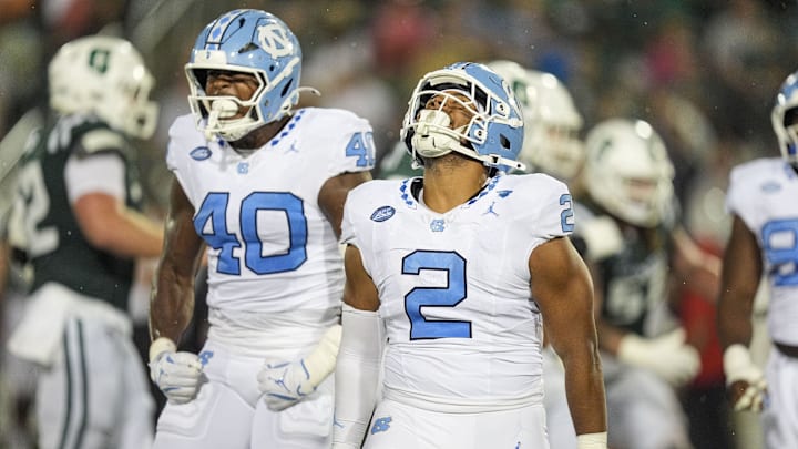 Sep 6, 2025; Charlotte, North Carolina, USA; North Carolina Tar Heels linebacker Andrew Simpson (2) celebtates his sack along with linebacker Tyler Thompson (40) during the second half against the Charlotte 49ers at Jerry Richardson Stadium. Mandatory Credit: Jim Dedmon-Imagn Images