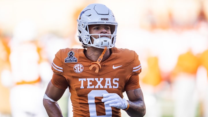 Dec 21, 2024; Austin, Texas, USA; Texas Longhorns wide receiver DeAndre Moore Jr. (0) against the Clemson Tigers during the CFP National playoff first round at Darrell K Royal-Texas Memorial Stadium. Mandatory Credit: Mark J. Rebilas-Imagn Images