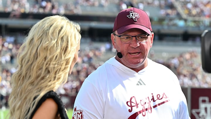 Oct 5, 2024; College Station, Texas, USA; SEC Nation host Laura speaks with Texas A&M Aggies head coach Mike Elko prior to the game between the Texas A&M Aggies and the Missouri Tigers at Kyle Field. Mandatory Credit: Maria Lysaker-Imagn Images. 