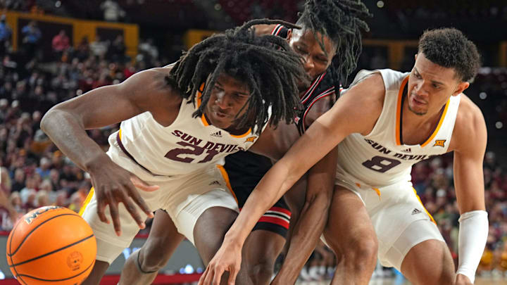 Arizona State's Jayden Quaintance (21) and Basheer Jihad (8) battle for a loose ball with Houston's Joseph Tugler (11) in the second half at Desert Financial Arena. Arizona State's Jayden Quaintance (21) and Basheer Jihad (8) battle for a loose ball with Houston's Joseph Tugler (11) in the second half at Desert Financial Arena.