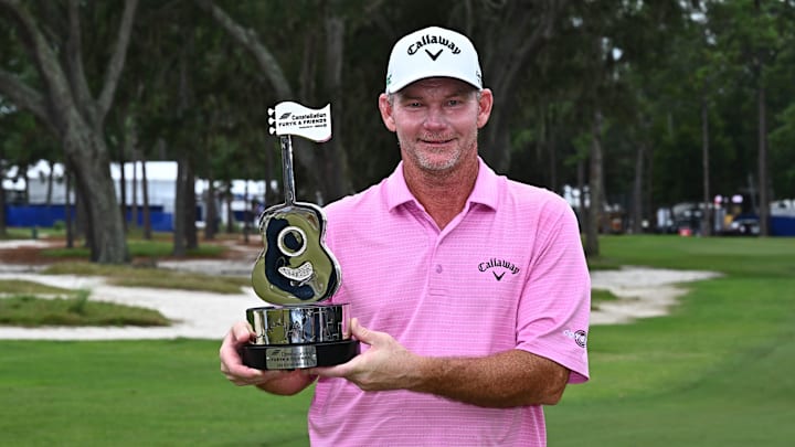 Tommy Gainey poses with the winner's trophy following his victory at the 2025 Constellation Furyk & Friends