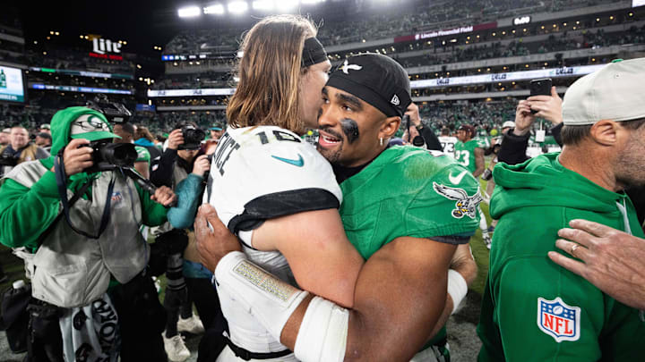 Nov 3, 2024; Philadelphia, Pennsylvania, USA; Philadelphia Eagles quarterback Jalen Hurts (1) greets Jacksonville Jaguars quarterback Trevor Lawrence (16) after a victory at Lincoln Financial Field. Mandatory Credit: Bill Streicher-Imagn Images