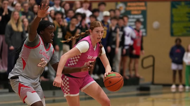 San Ramon Valley star junior guard Ella Gunderson dribbles left against Carondelet sophomore Niylah Christopher in the Wolves' 70-49 win in the East Bay Athletic League playoff championship. The two teams are seeded one and two in the North Coast Section Open Division playoffs which continue on Wednesday. San Ramon Valley hosts Clayton Valley Charter while Carondelet hosts Piedmont.