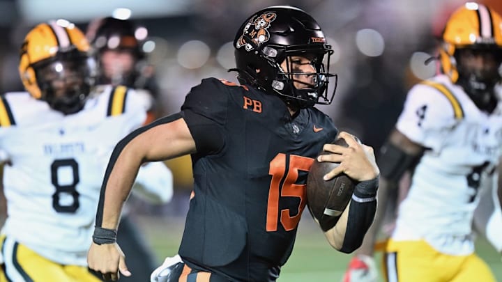 Massillon (Ohio) quarterback DaOne Owens runs away from Valdosta (Georgia) defenders during a 28-17 Massillon win in 2023.