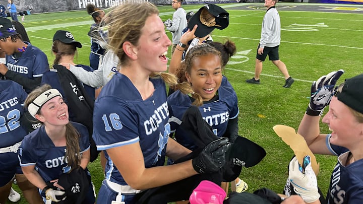 Clarksburg flag football players celebrate their victory over Boonsboro after the finals of Maryland's first girls flag football state championship, hosted by the Baltimore Ravens at M&T Bank Stadium.