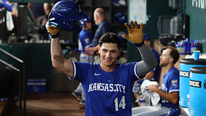 Jac Caglianone of the Kansas City Royals celebrates alone in the dugout after his first career home run.