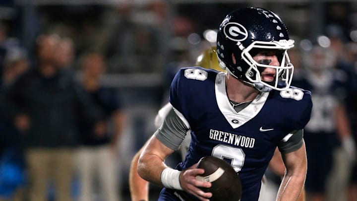 Greenwood's Kane Archer is chased out of the pocket by a Pulaski Academy defender while looking for a receiver during the 5A West Conference game on Oct. 28 at Smith Robinson Stadium.

Greenwood Pul Acad Fb 102822 04