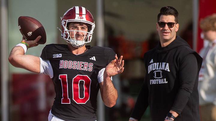 Indiana's Josh Hoover (10) throws in front of Tino Sunseri during spring practice at Memorial Stadium on Tuesday, March 31, 2026.