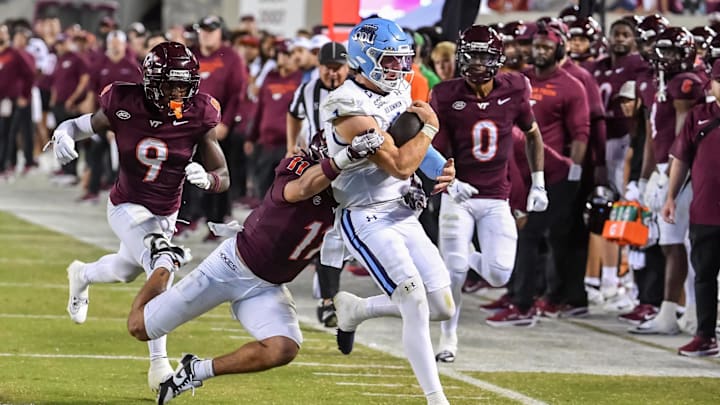 Sep 13, 2025; Blacksburg, Va.; Virginia Tech safety Tyson Flowers (11) tackles Old Dominion quarterback Colton Joseph (1). Sep 13, 2025; Blacksburg, Va.; Virginia Tech safety Tyson Flowers (11) tackles Old Dominion quarterback Colton Joseph (1).