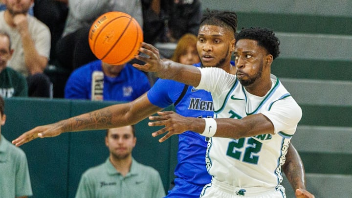 Jan 30, 2025; New Orleans, Louisiana, USA;  Tulane Green Wave guard Asher Woods (22) passes the ball against the Memphis Tigers during the first half at Avron B. Fogelman Arena in Devlin Fieldhouse.
