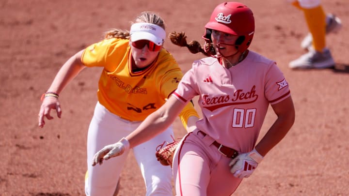 Texas Tech's Jackie Lis (00) is tagged out by Iowa State's Reagan Bartholomew during a Big 12 Conference softball game, Sunday, March 29, 2026, at Tracy Sellers Field.