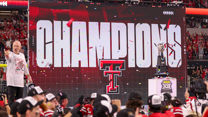 Texas Tech head coach Joey McGuire stands on stage after the Red Raiders defeated BYU 34-7 in the Big 12 Championship football game, Saturday, Nov. 6, 2025, at AT&T Stadium in Arlington.