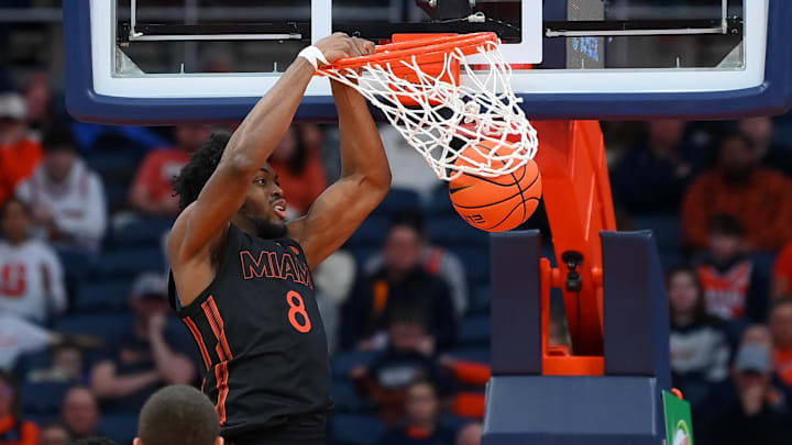Jan 24, 2026; Syracuse, New York, USA; Miami Hurricanes center Ernest Udeh Jr. (8) dunks during the second half against the Syracuse Orange at the JMA Wireless Dome. Mandatory Credit: Rich Barnes-Imagn Images