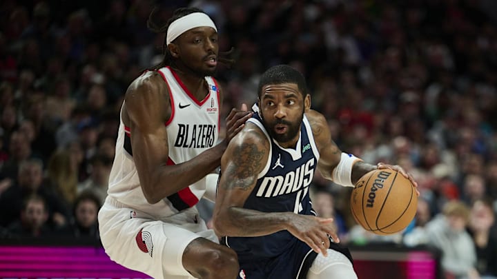 Dec 28, 2024; Portland, Oregon, USA; Dallas Mavericks guard Kyrie Irving (11) drives to the basket during the second half against Portland Trail Blazers forward Jerami Grant (9) at Moda Center. Mandatory Credit: Troy Wayrynen-Imagn Images Dec 28, 2024; Portland, Oregon, USA; Dallas Mavericks guard Kyrie Irving (11) drives to the basket during the second half against Portland Trail Blazers forward Jerami Grant (9) at Moda Center. Mandatory Credit: Troy Wayrynen-Imagn Images