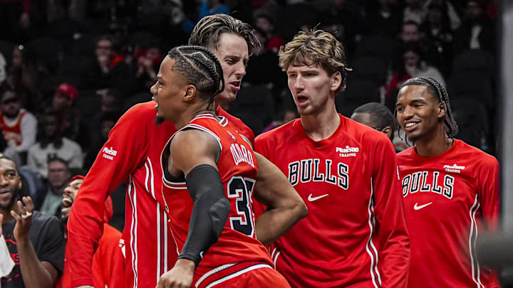Dec 21, 2025; Atlanta, Georgia, USA; Chicago Bulls forward Isaac Okoro (35) reacts with forward Zach Collins (12) after scoring a basket against the Atlanta Hawks during the second half at State Farm Arena. Mandatory Credit: Dale Zanine-Imagn Images